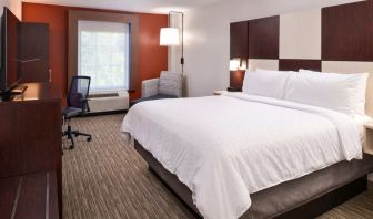 Spacious king bedroom with TV and work station at Holiday Inn Express Towson Baltimore N.