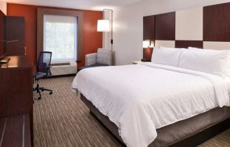 Spacious king bedroom with TV and work station at Holiday Inn Express Towson Baltimore N.