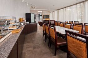 Best Western Braintree’s breakfast area has a hard floor, large windows, and plenty of tables.