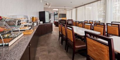 Best Western Braintree’s breakfast area has a hard floor, large windows, and plenty of tables.