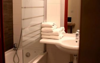 Private guest bathroom with shower at Eurohotel Airport Orly Rungis.