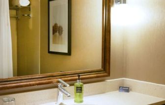 Private guest bathroom with shower at Pacific Gateway Hotel Vancouver Airport.