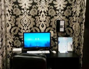 Dedicated business center with PC, internet, and printer at Ramada by Wyndham Vancouver Downtown.