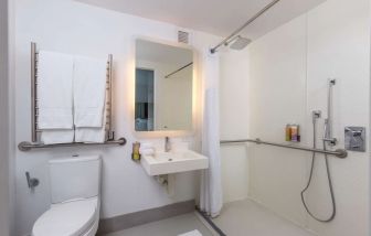 Private guest bathroom with shower at YOTEL New York.