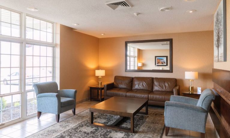 Comfortable seating area in the hotel lobby, with lamps and coffee tables.