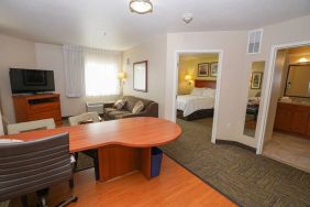 Guest room in Candlewood Suites Boise, with a workspace desk and chair.