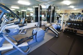 Candlewood Suites Boise’s fitness center has racks of weights and assorted exercise machines.