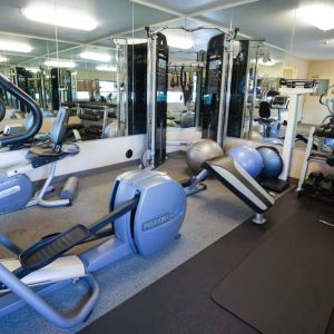 Candlewood Suites Boise’s fitness center has racks of weights and assorted exercise machines.