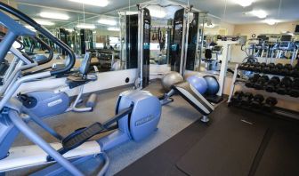 Candlewood Suites Boise’s fitness center has racks of weights and assorted exercise machines.