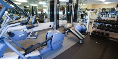 Candlewood Suites Boise’s fitness center has racks of weights and assorted exercise machines.