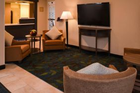 The hotel’s lounge in the lobby has armchairs, coffee tables, and a large widescreen TV.