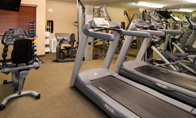 The hotel fitness center offers both weights and exercise machines for guests to use.