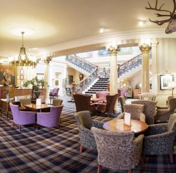 The Royal Highland Hotel’s lobby lounge has armchairs and coffee tables.