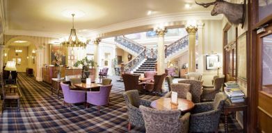 The Royal Highland Hotel’s lobby lounge has armchairs and coffee tables.