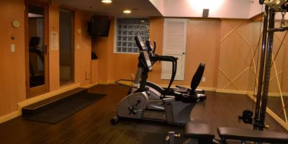 The hotel fitness center has exercise machines and a television.