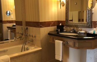 Private guest bathroom with shower at Grand Hyatt Muscat.