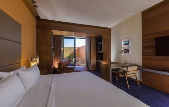 Spacious king bedroom with TV and work station at Hyatt Centric Campestre Leon.