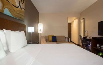 Spacious king bedroom with TV and work station at Hyatt Place Aguascalientes/Bonaterra.