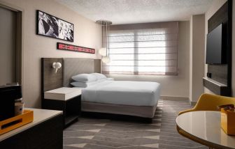 Spacious king bedroom with TV at Hyatt Regency at Los Angeles International Airport.