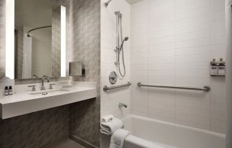 Private guest bathroom with shower at Hyatt Regency at Los Angeles International Airport.