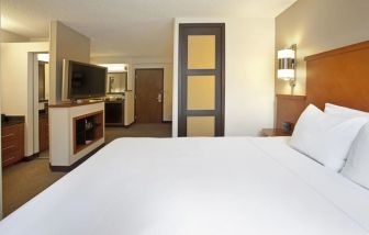 Spacious king bedroom with TV at Hyatt Place Baltimore/Owings Mills.