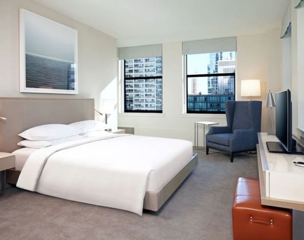 Delux king bed with TV and business desk at Hyatt Centric The Loop Chicago.
