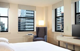 Spacious king bedroom with TV at Hyatt Centric The Loop Chicago.