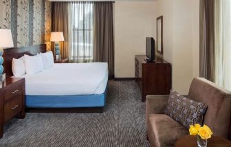 Spacious king bedroom with TV at Hyatt Regency Buffalo Hotel And Conference Center.