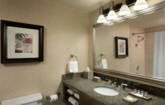 Private guest bathroom with shower at Hyatt Regency Houston West.