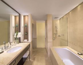 Private guest bathroom with shower at Grand Hyatt Doha Hotel & Villas.