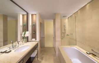 Private guest bathroom with shower at Grand Hyatt Doha Hotel & Villas.