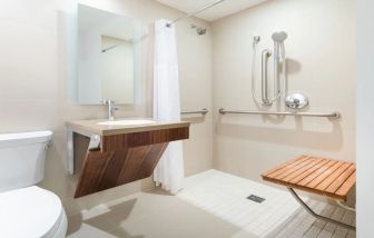 Private guest bathroom with shower at Hyatt Herald Square New York.