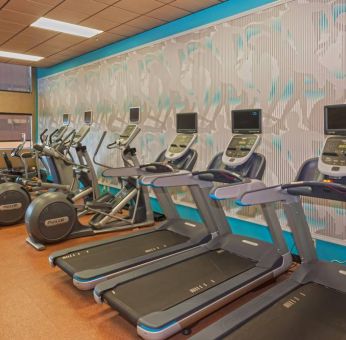 The hotel’s fitness center comes with assorterd exercise machines for guests.