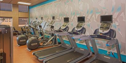 The hotel’s fitness center comes with assorterd exercise machines for guests.