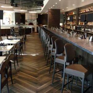 The Crowne Plaza Aire MSP Airport - Mall Of America’s restaurant and bar has table and bar stool seating.