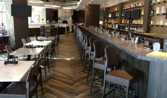 The Crowne Plaza Aire MSP Airport - Mall Of America’s restaurant and bar has table and bar stool seating.