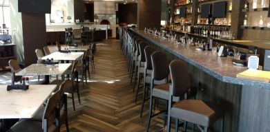 The Crowne Plaza Aire MSP Airport - Mall Of America’s restaurant and bar has table and bar stool seating.