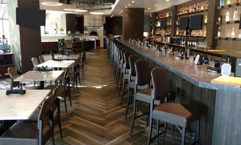 The Crowne Plaza Aire MSP Airport - Mall Of America’s restaurant and bar has table and bar stool seating.