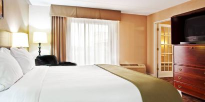 Holiday Inn Express Rolling Meadows-Schaumburg guest room, including large bed and nearby window.