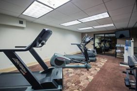 The hotel’s fitness center has racks of weights and numerous exercise machines.