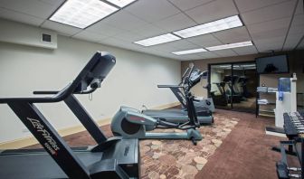 The hotel’s fitness center has racks of weights and numerous exercise machines.