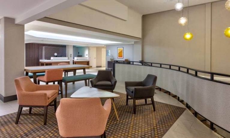 The hotel’s lobby lounge offers comfortable seating and coffee tables.