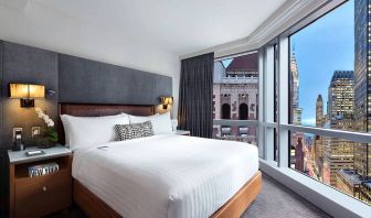 Hotel 48LEX New York guest room with double bed and stunning city view.