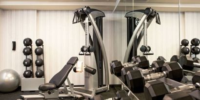 The Hotel 48LEX New York’s fitness center, with weights and exercise machinery.