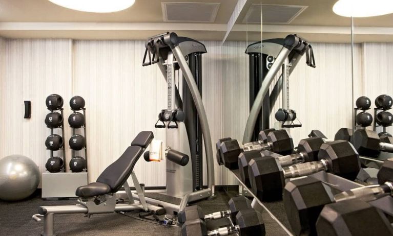 The Hotel 48LEX New York’s fitness center, with weights and exercise machinery.