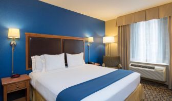 At guest room in the Holiday Inn Express New York City – Chelsea, with large bed and window.