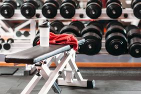 The hotel fitness center, with bench and wide selection of weights.