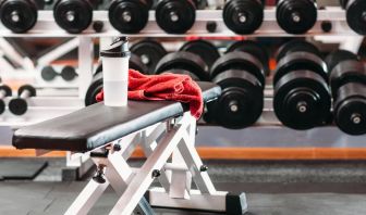 The hotel fitness center, with bench and wide selection of weights.