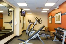 The hotel fitness room, which has rows of weights and assorted exercise machines.