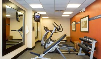 The hotel fitness room, which has rows of weights and assorted exercise machines.